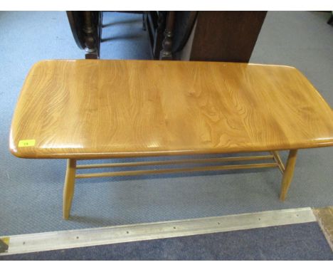 An Ercol coffee table with slatted rail below on splayed legsLocation: RAB 