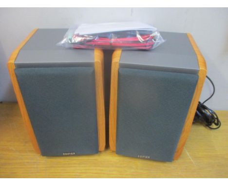 Pair of Edifier speakers, 4" bass drivers and 3/4" silk-diaphragm tweeter, can connect up to two Bluetooth devices simultaneo