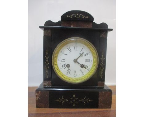 A Victorian black and mottled marble mantel clock 