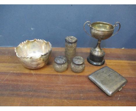 A small group of silver items to include a trophy 59.4g on stand, an engine gurned cigarette case 75.6g, a group of three sil