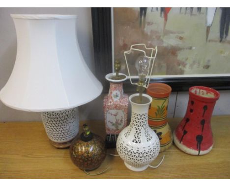 Table lamps to include three white glazed pierced examples, a Chinese vase style lamp, a lacquered lamp, two drum bases and o