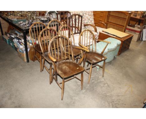 A set of six Ercol stick back dining chairs - four standards, two elbows 