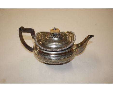 A George III silver teapot, (some dents)