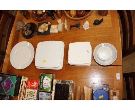 A collection of white glazed teaware to include saucers and side plates 