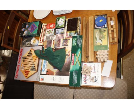 A collection of various games to include playing cards, Connect Four, Chinese Chequers, Mah Jong etc.