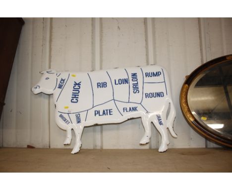 An enamel decorated cow sign