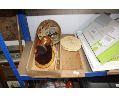 A pine chopping board, various wooden kitchen implements, table lamp etc.