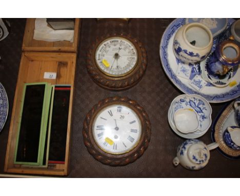 A circular carved oak clock and matching barometer  AF