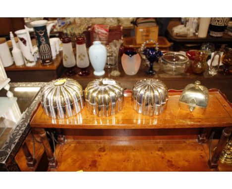 Three far Eastern circular boxes and lids of fluted form; and another casket shaped trinket box 