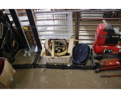 A metal fender; a quantity of brass light fittings; an enamel casserole dish; wicker baskets; a pet cage etc
