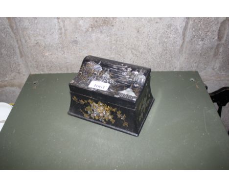 A papier maché and mother of pearl inlaid trinket box  AF