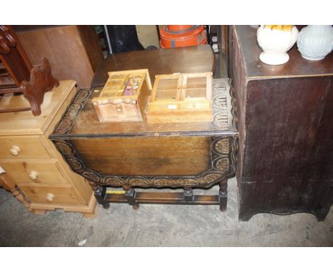 An oak gate leg drop leaf tea table 