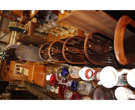 A set of four stick and wheel back dining chairs