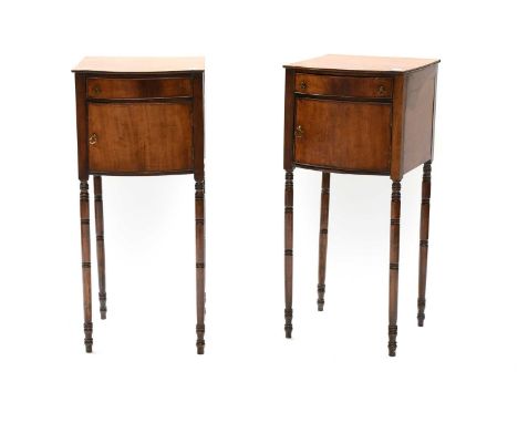 Pair of Regency Mahogany Bedside Cupboards, bow fronted, with brass axe head handles, each with a single drawer and on ring t