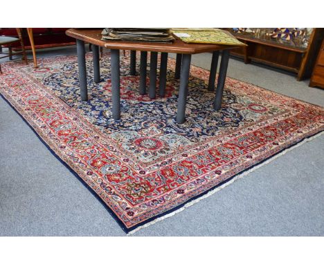 Khorasan Carpet, the indigo field of vines centred by a medallion framed by sky blue spandrels and blood red borders of meand