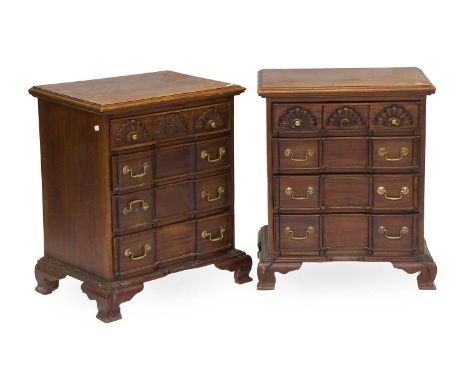A Pair of Reproduction Mahogany Four Height Bedside Chests, block fronted and on ogee bracket supports, 60cm by 42cm by 70cm 