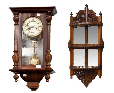 A Victorian Mahogany Three Tier Corner Wall Shelf, with open work carving, pierced gallery rails, and having bevelled mirror 