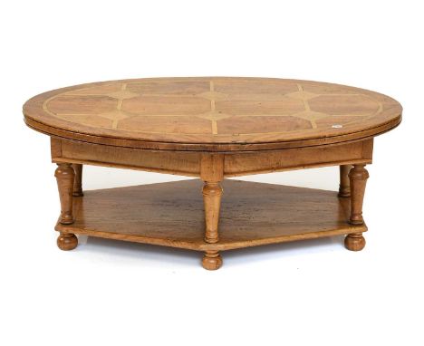 A Barker &amp; Stonehouse 'Flagstone' Oval Coffee Table, with under tier and compressed bun feet, 122cm by 83cm by 45cm