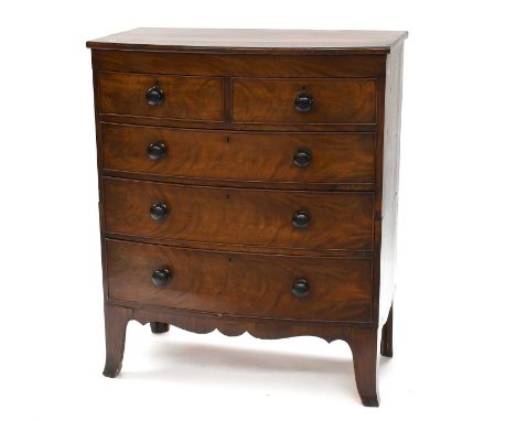 A Regency Mahogany Bow Front Four Height Chest of Drawers, with turned drawer pulls and on splay bracket supports, 95cm by 51
