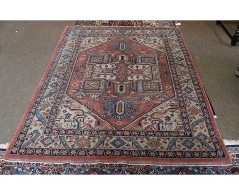 Heriz Design Rug of Unusual Size, the terracotta field centred by an ivory anchor medallion enclosed by serrated leaf borders