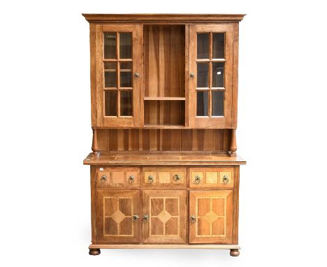 A Barker &amp; Stonehouse 'Flagstone' Bookcase, with glazed top section, over a three drawer and cupboard base, on compressed