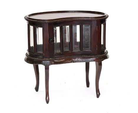 A Reproduction Mahogany Tray Topped Drinks Table Cabinet, of kidney shape, with bevelled glass panels, and on scroll supports