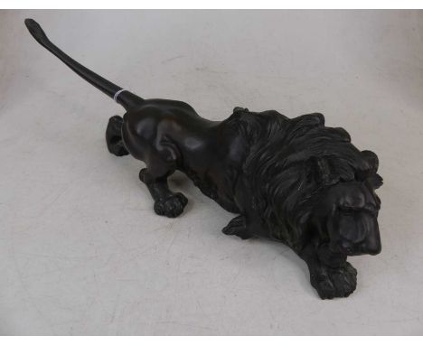 A Japanese bronze model of a lion, seal mark to the underside, length 40cmAppears to be complete and free from breaks.Patina 