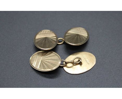A pair of gent's 9ct gold oval cufflinks, having engine turned and sunburst engraved decoration, 4.8g, each measuring 19 x 14