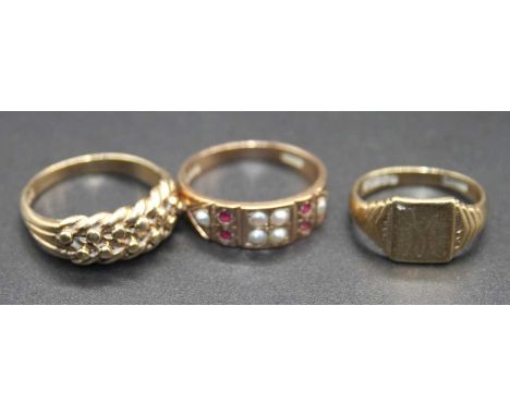 A 9ct gold child's signet ring, size H; together with a 9ct gold, ruby and seed pearl set half hoop ring, size N; and a 9ct g