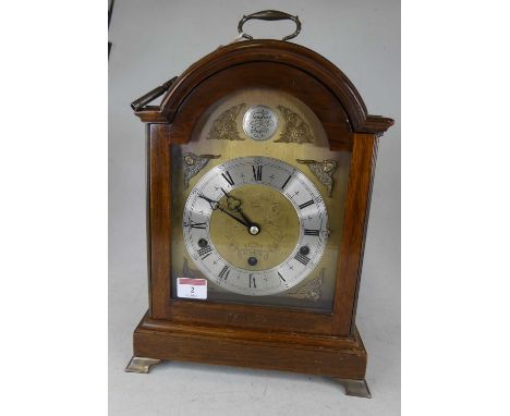 A 20th century mahogany cased bracket clock, in the 18th century style, the silvered chapter ring showing Roman numerals, wit