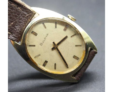 A vintage gents Bulova gold plated cased wrist watch having signed oval dial and manual wind movement, case dia. 23mm
