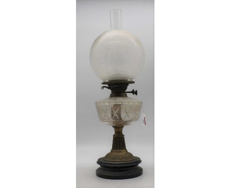 A Victorian brass oil lamp, having an acid etched clear glass shade, h.57cm 