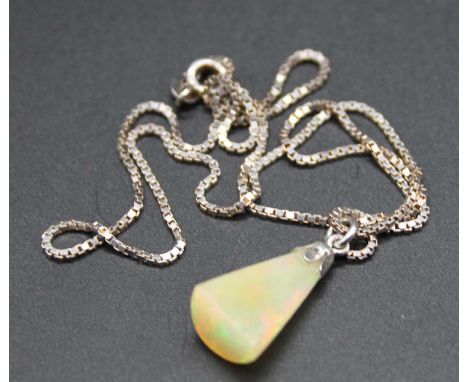 A polished opal pendant weighing approx 7ct, and measuring 19x10x7mm on silver fine box link neck chain