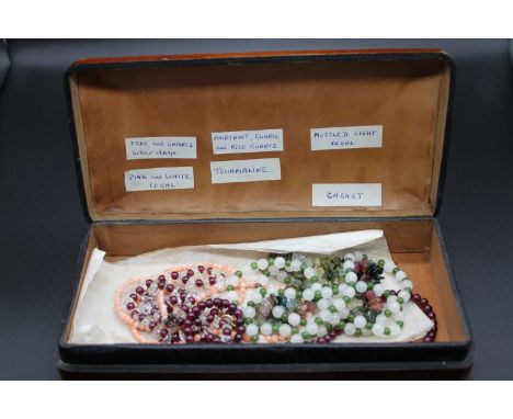 An Italian gilt tooled leather box, w.20cm; together with a pink coral necklace and matching bracelet, amethyst quartz and ro