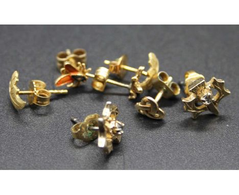 A pair of modern 18ct gold ear studs, modelled as fern leaves, on post fittings; together with a modern pair of yellow metal 