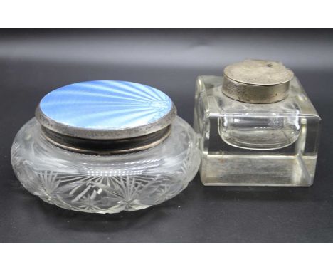 A George V silver dressing table jar having squat glass body with silver and blue guilloche enamelled top, together with a si