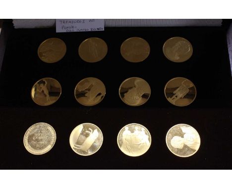 A cased set of John Le Pinche's Treasures of Pompeii gold plated on bronze medallions housed in wooden display case