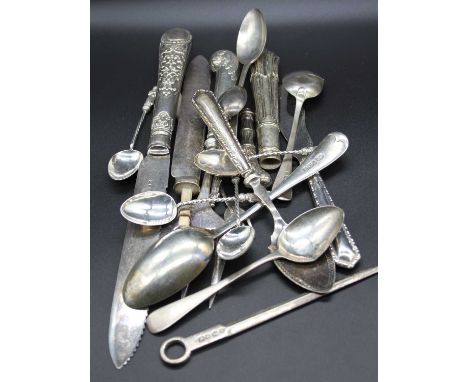 A small collection of silver and silver clad flatware to include silver plated toasting fork with pistol grip handle, tea spo