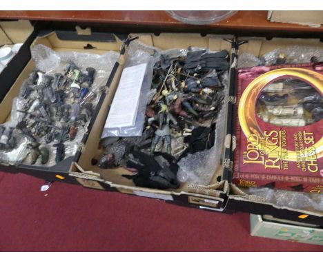 Three boxes of The Lord of the Rings action figures, and a Lord of the Rings 'The Two Towers' chess set 