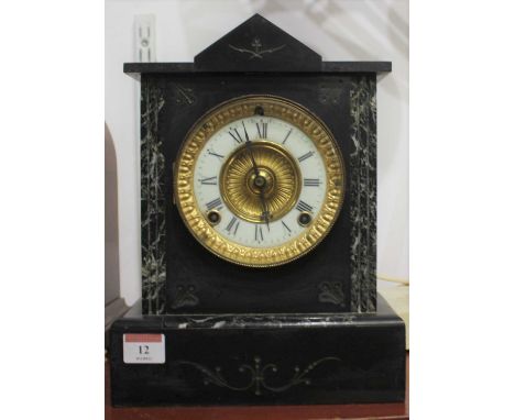 A Victorian black slate mantel clock, the enamelled chapter ring showing Roman numerals, the eight-day movement striking on a