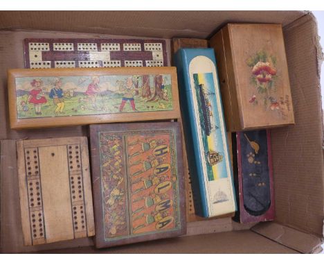 A collection of vintage games, to include chess pieces and cribbage boards 