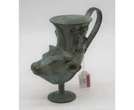 A verdigris bronze rhyton in the form of a cow's head, h.18cm