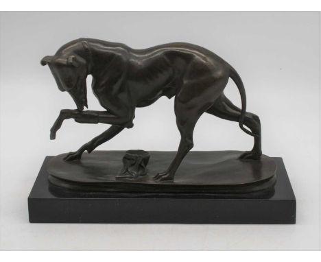 A modern bronze modelled as a dog, in standing pose licking its raised paw, on marble plinth, w.30cm 