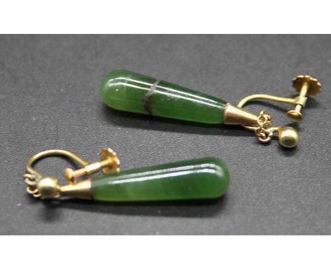 A pair of 9ct gold and green jade ear pendants having screw fittings and conical jade drops (one broken and restored) 3.7g, 4