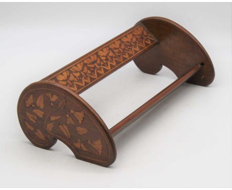 An early 20th century walnut and marquetry inlaid book trough, w.42cm