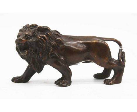 A bronze model of a lion, length 15cm 