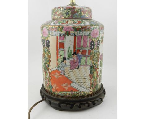 A Chinese Canton style table lamp base, decorated in the famille rose palette with panels of figures, flowers and foliage, ra