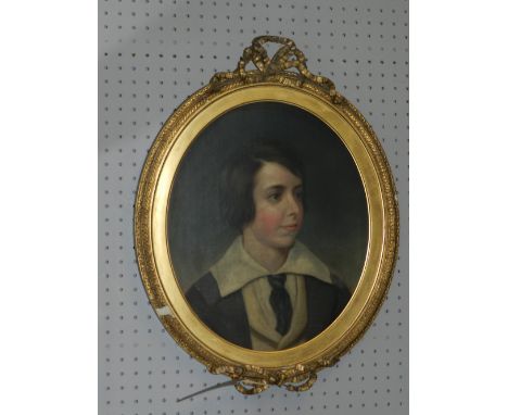 19th Century British School, a portrait study of a boy, oil on canvas, inscription to verso, feigned to oval, within a giltwo