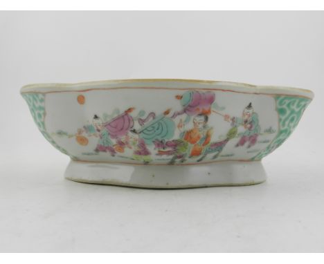 A Chinese Canton style footed bowl, decorated in the famille rose palette, bears seal mark to base. H.18.5cm