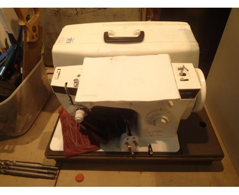 Cased Fashion Mate sewing machine including booklet, power lead, pedal and a small quantity of accessories. Not available for